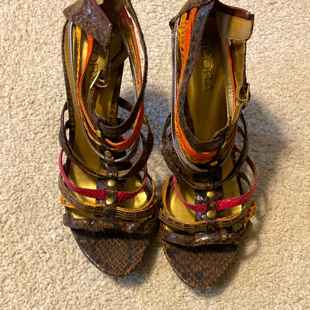 Women’s size 9 heels with colors: silver, orange, brown, dark pink and cheetah